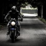 motorcycle rider dark background