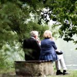 senior couple sitting outside