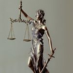 statue with scales of justice