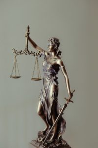statue with scales of justice