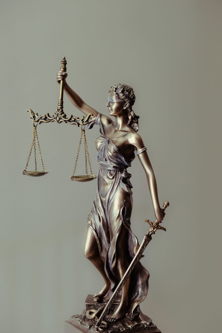 statue with scales of justice
