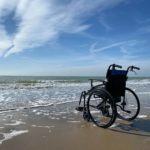 empty wheelchair at beach