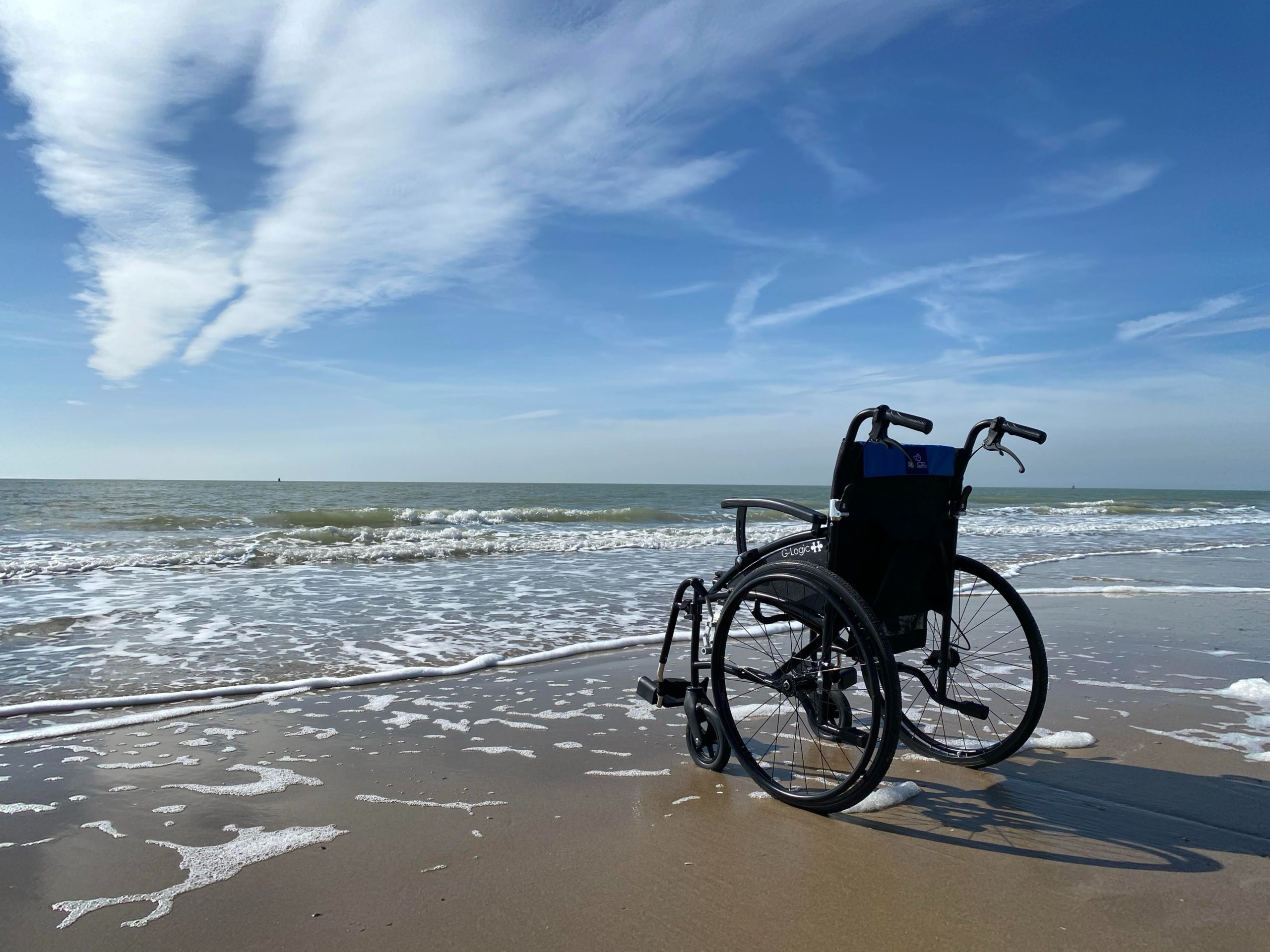 empty wheelchair at beach
