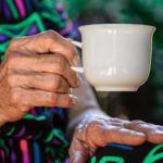 elderly woman drinking coffee