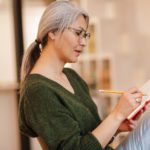 woman writing in journal