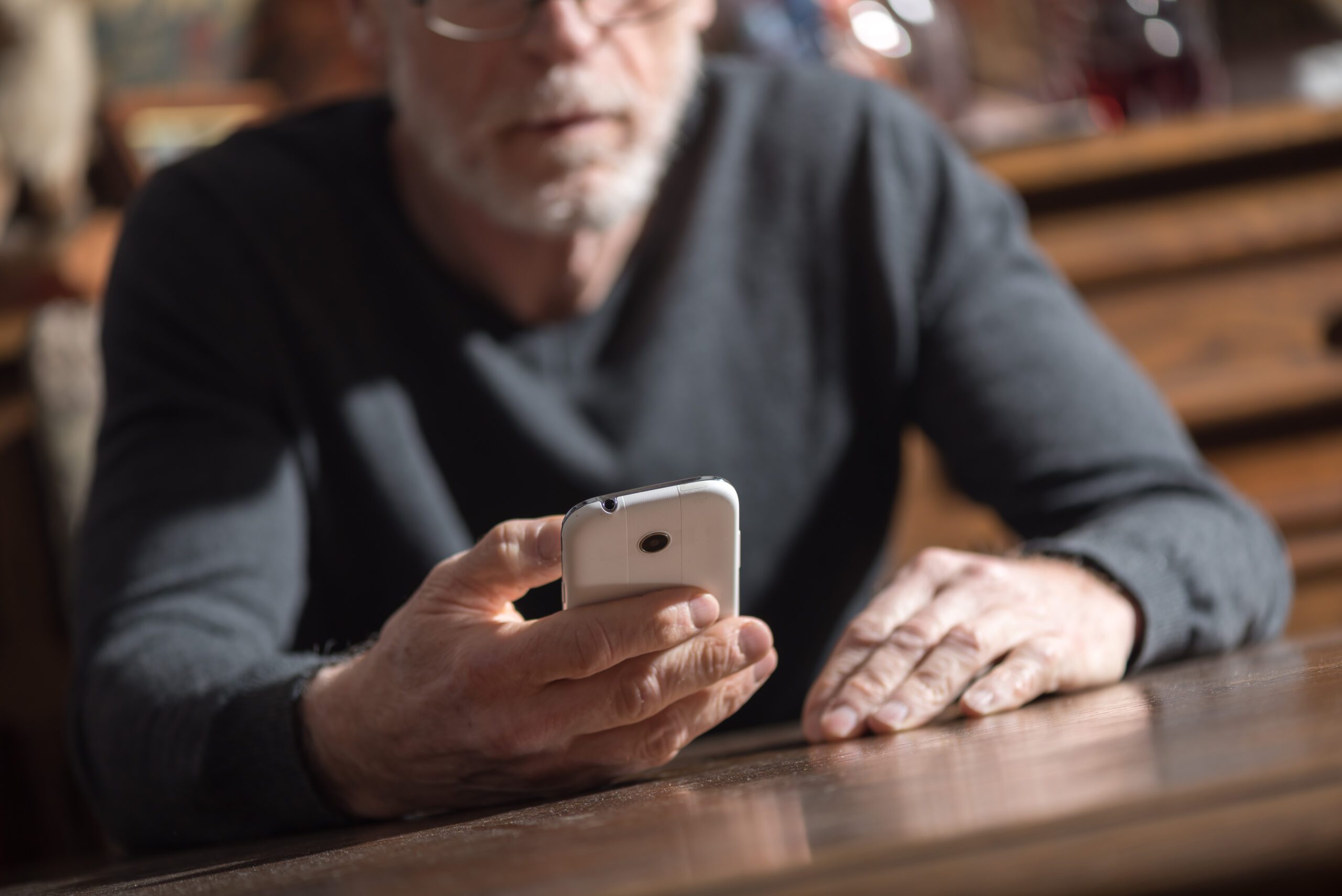 senior man using smartphone