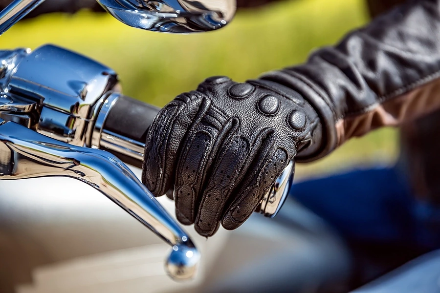 Close of of rider holding motorcycle handle